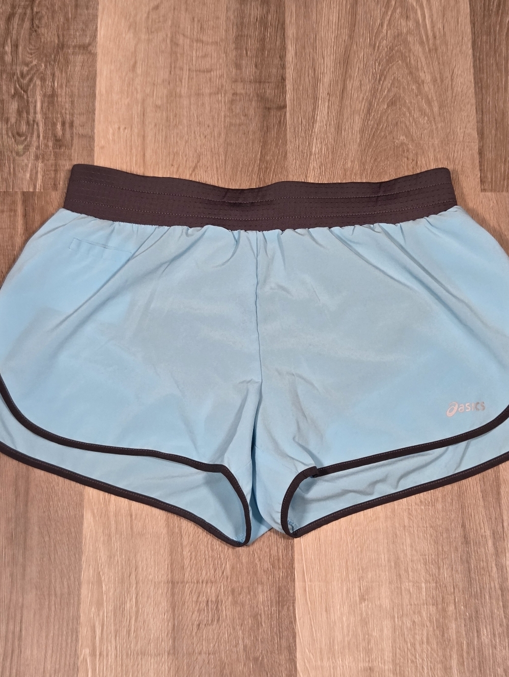 light blue ASICS athletic shorts with dark trim Medium